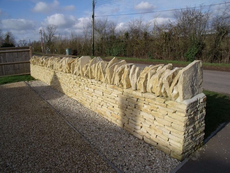 New dry stone wall in Tinker's Barn limestone at Duns Tew