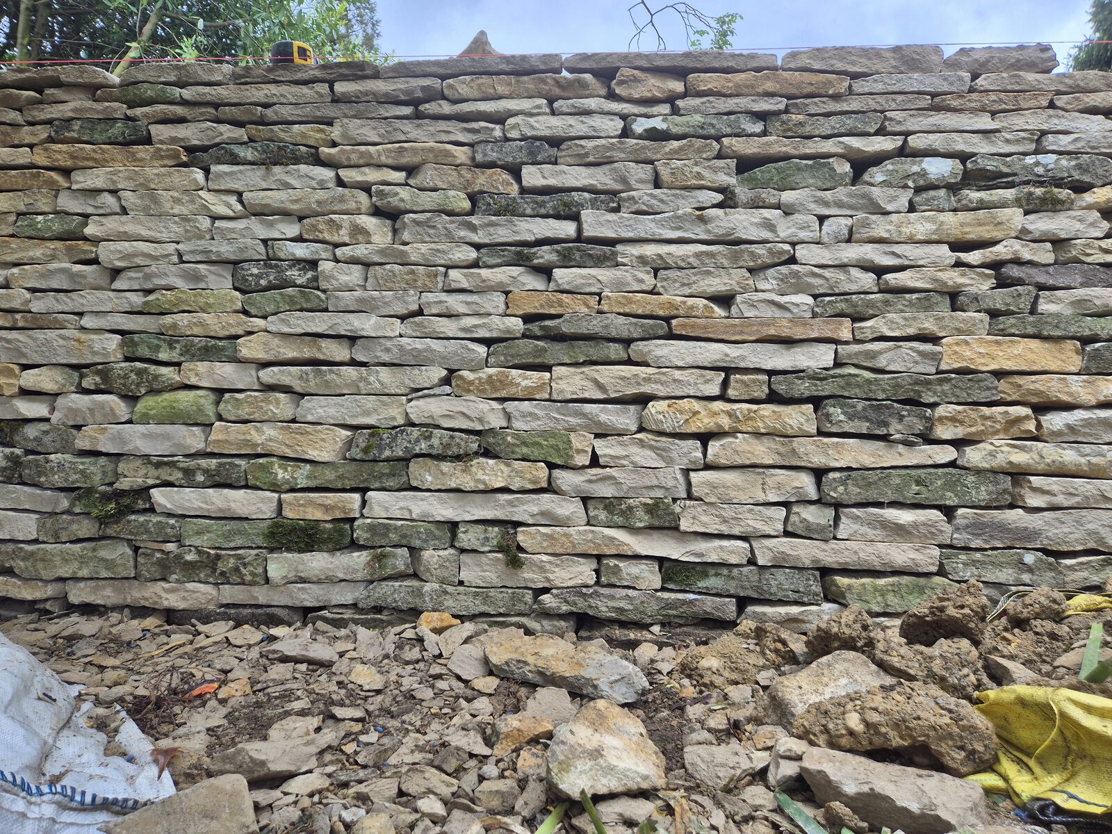 Newly rebuilt dry stone garden wall elevation before coping, Oxfordshire 2026
