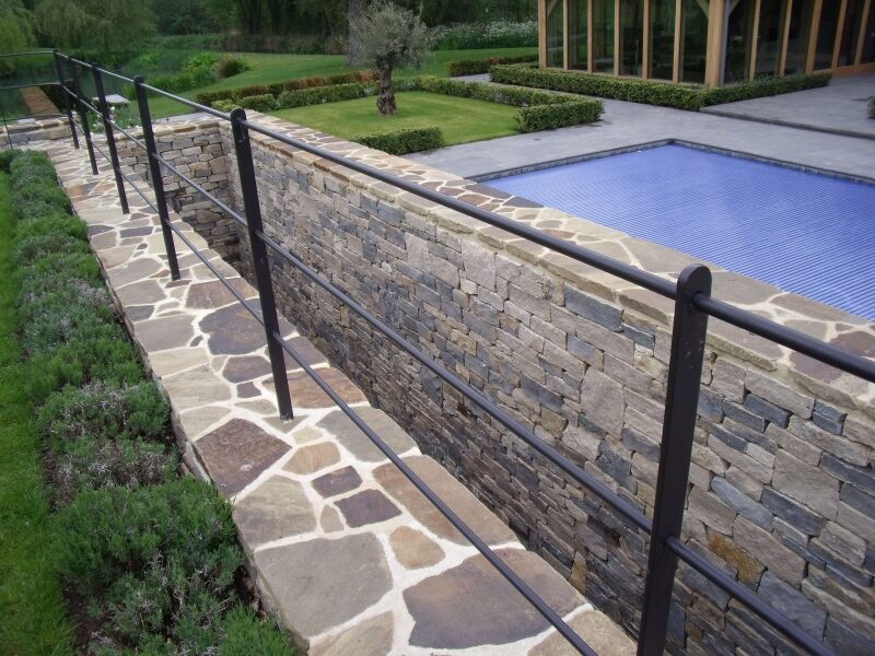 Dry stone terrace walls with stone steps at a private estate garden